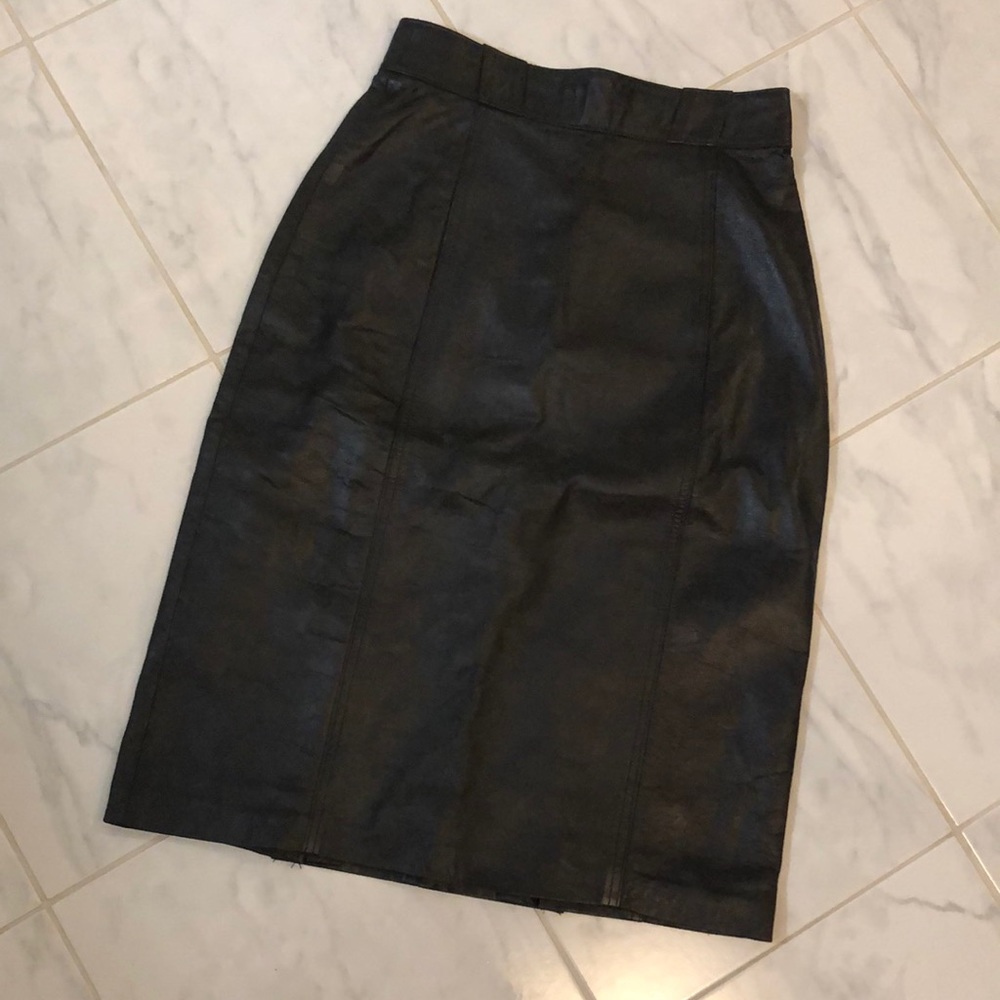 Black leather vintage pencil skirt. Nicoles boutique of leather. Crown design.